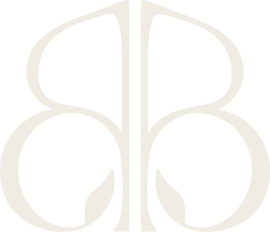 Stylized, symmetrical logo with mirrored, abstract shapes resembling the lowercase letters 