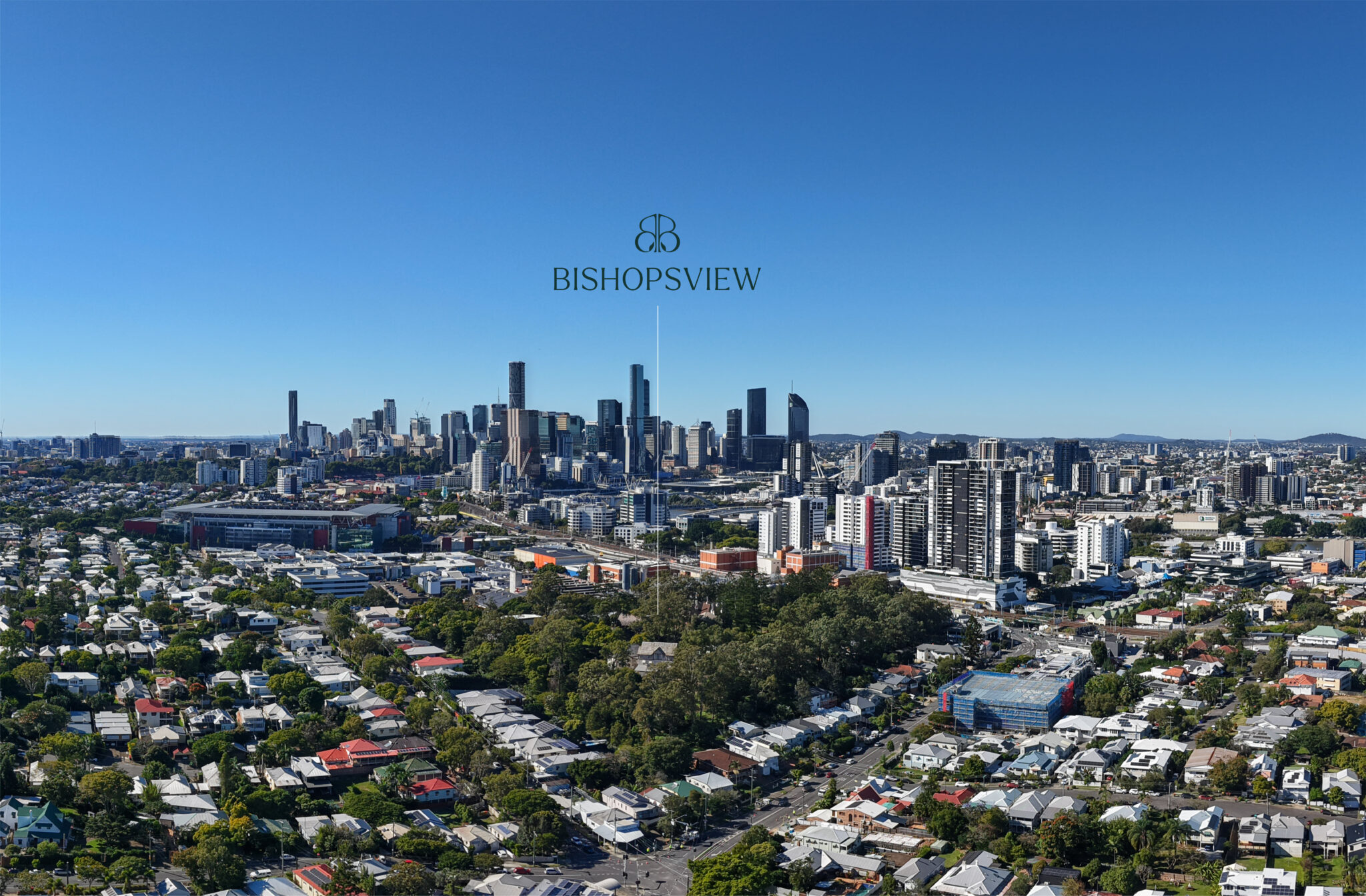 A panoramic aerial view of Brisbane city’s skyline under a clear blue sky, with urban and residential areas in the foreground and tall skyscrapers in the distance. The text "BISHOPSVIEW" is centered at the top.