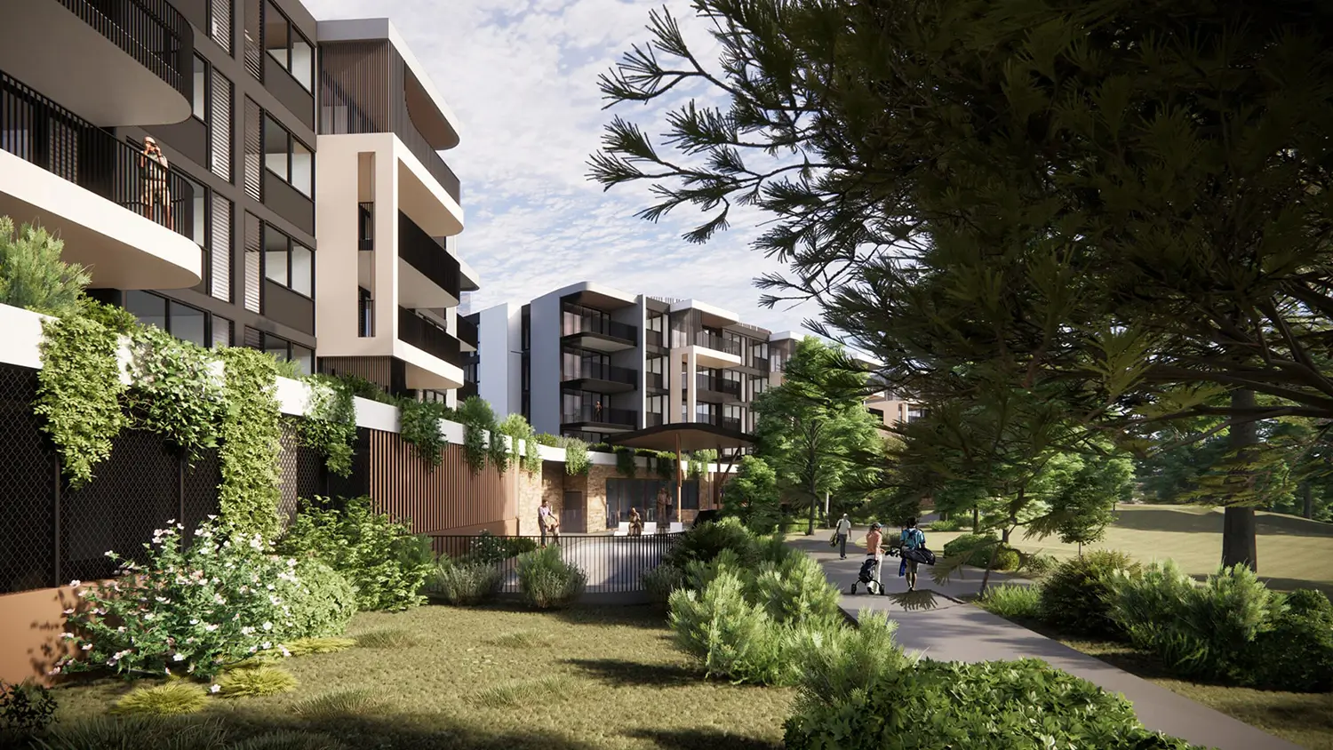 Modern apartment buildings at The Evelyn Mt Ommaney feature balconies overlooking a landscaped green space with trees, bushes, and a walking path. People stroll and relax on benches in this park-like setting under a partly cloudy sky.